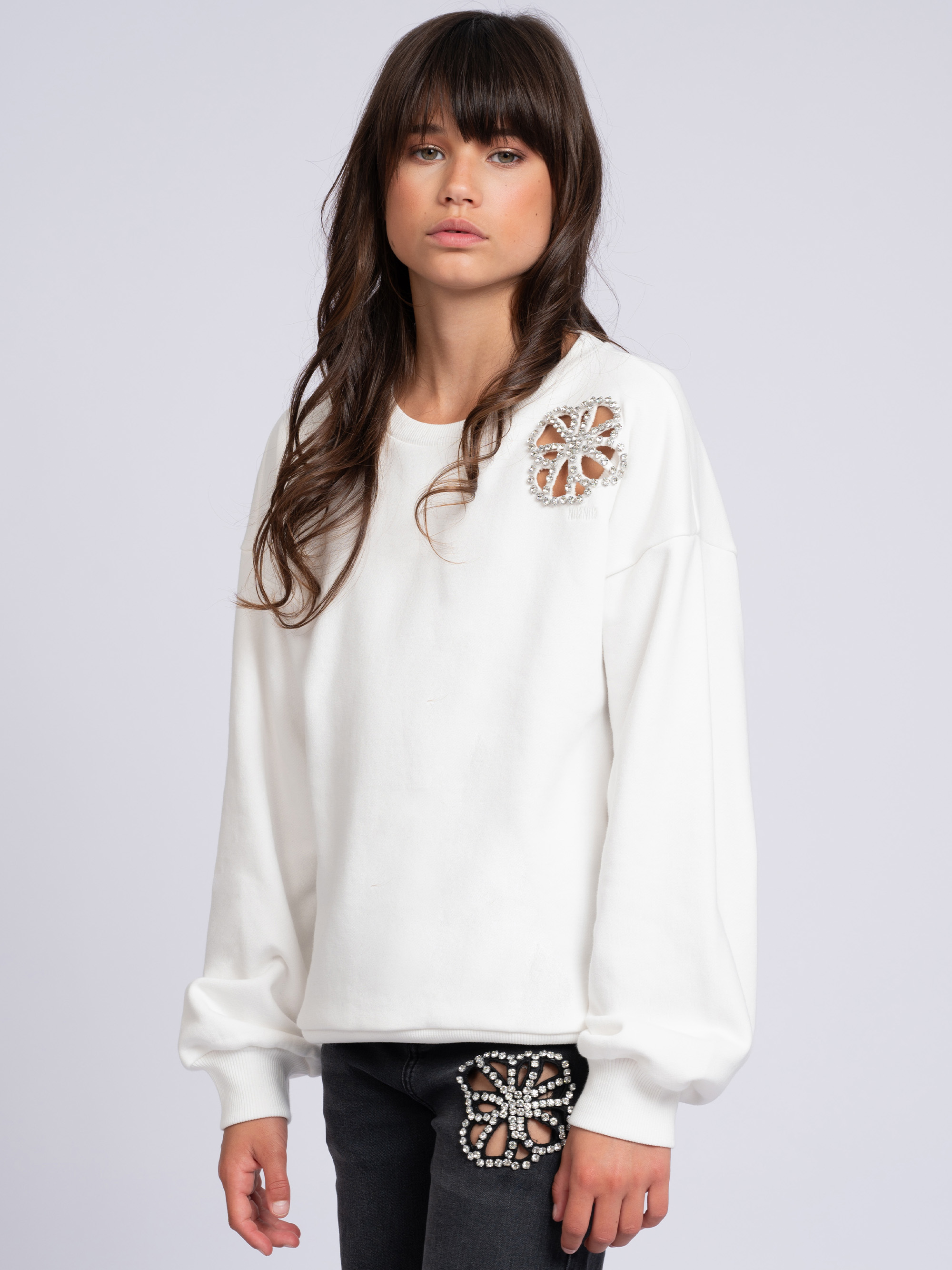 Sweater with flower-shaped cutout and rhinestone details